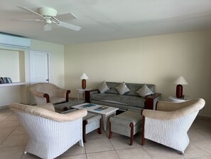 Deluxe Villa, 2 Bedrooms, Ocean View | Living area | 100-cm TV with cable channels - Sapphire Beach Club Resort (Lowlands)