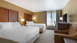 A hotel room with two beds, a desk, a chair, a television, and a window with curtains. - Comfort Inn Green Valley I-19 (Green Valley)