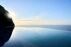 Outdoor pool, open 9:00 AM to 6:00 PM, pool umbrellas, sun loungers