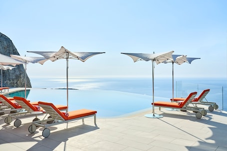 Outdoor pool, open 9:00 AM to 6:00 PM, pool umbrellas, sun loungers