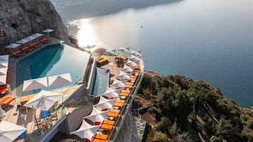 Outdoor pool, open 9:00 AM to 6:00 PM, pool umbrellas, sun loungers