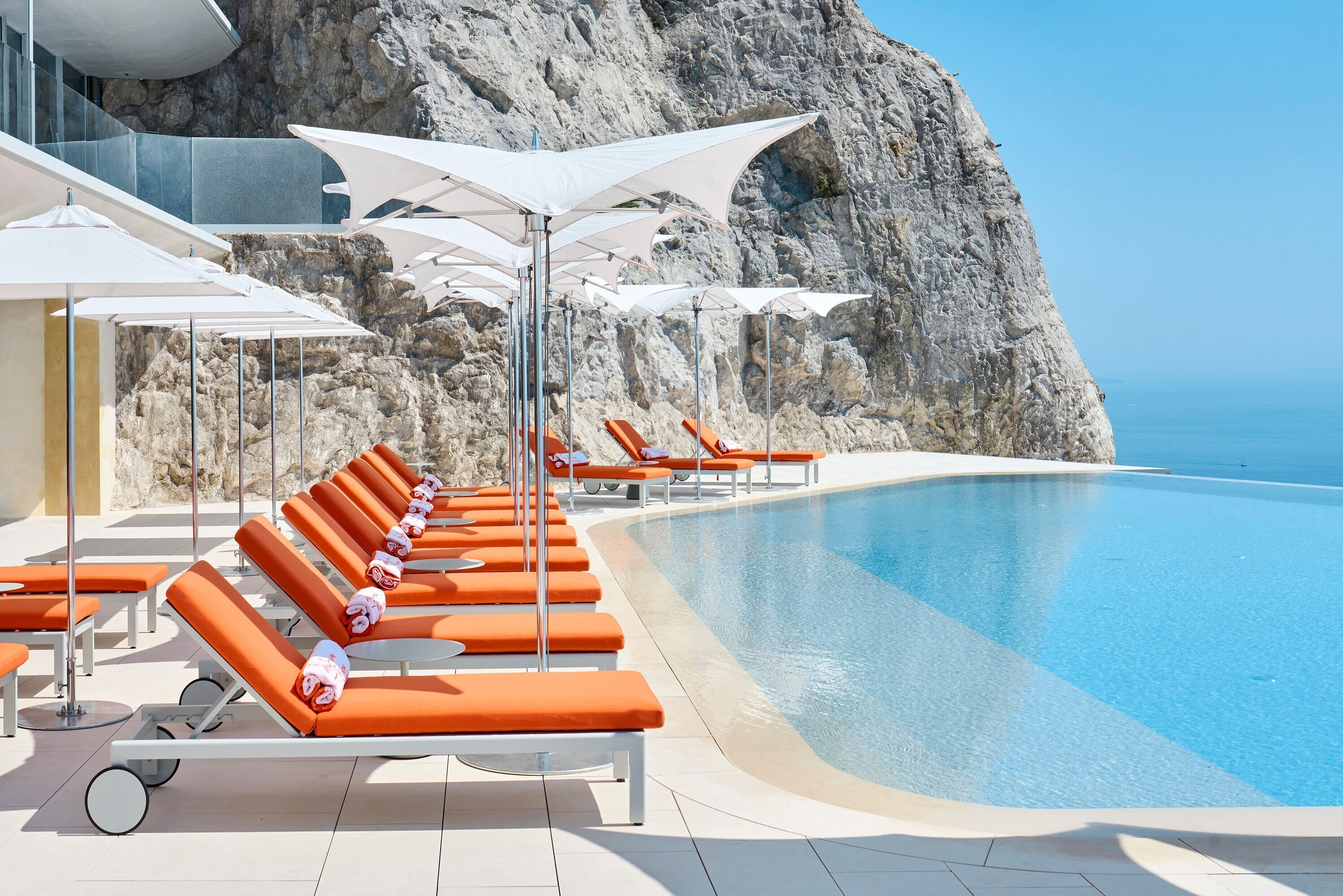 Outdoor pool, open 9:00 AM to 6:00 PM, pool umbrellas, sun loungers