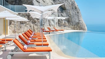 Outdoor pool, open 9:00 AM to 6:00 PM, pool umbrellas, sun loungers