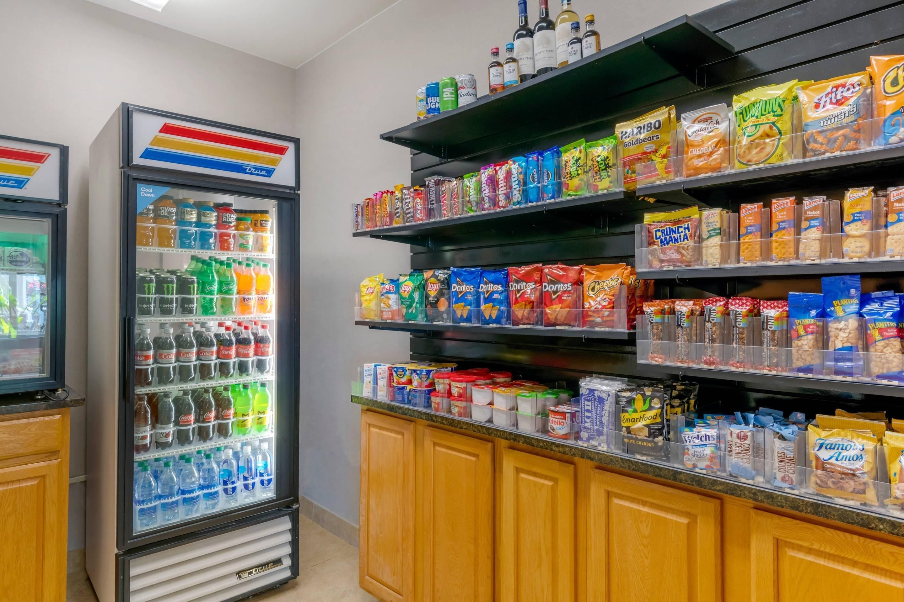 A snack and beverage display with various snacks and drinks.