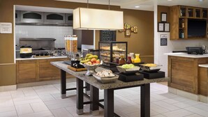 A breakfast buffet setup with various food items and a coffee station. - Hilton Garden Inn Houston/Bush Intercontinental Airport (Houston)
