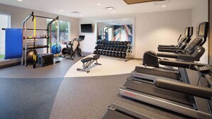 A gym with treadmills, dumbbells, a pull-up bar, and exercise equipment. - Hilton Garden Inn Houston/Bush Intercontinental Airport (Houston)