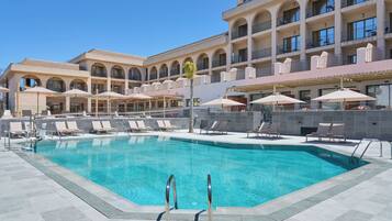 Seasonal outdoor pool, open 10:00 AM to 8:00 PM, pool loungers