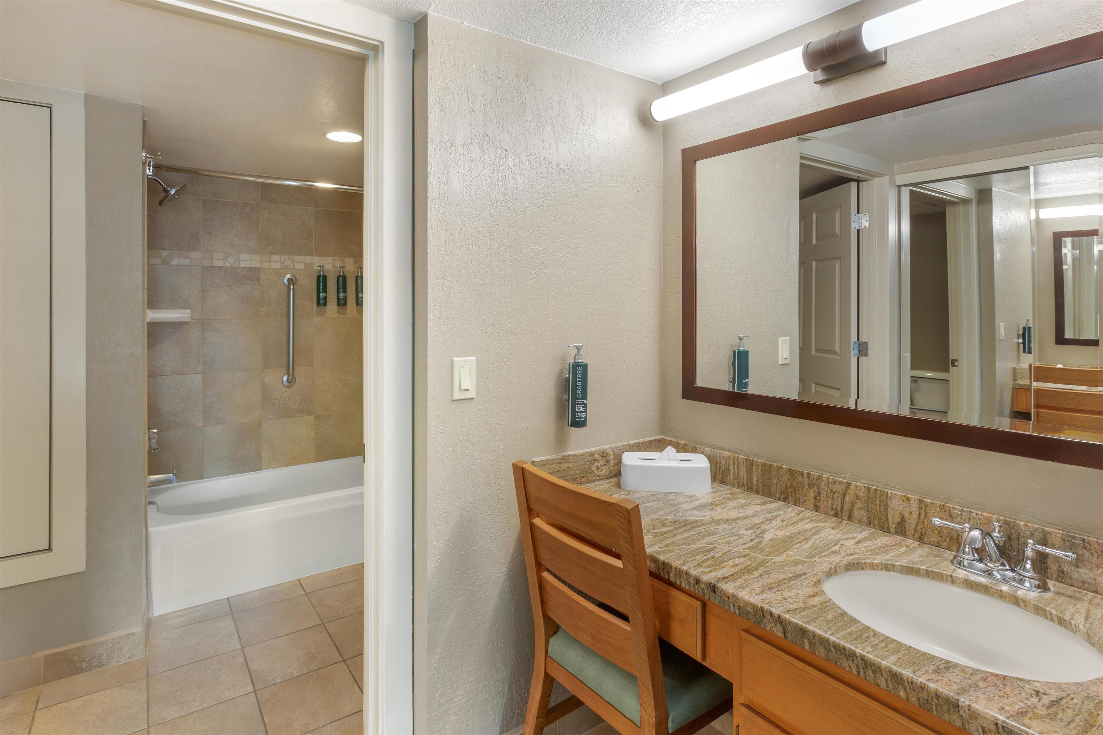 bathtub, free toiletries, hair dryer, towels