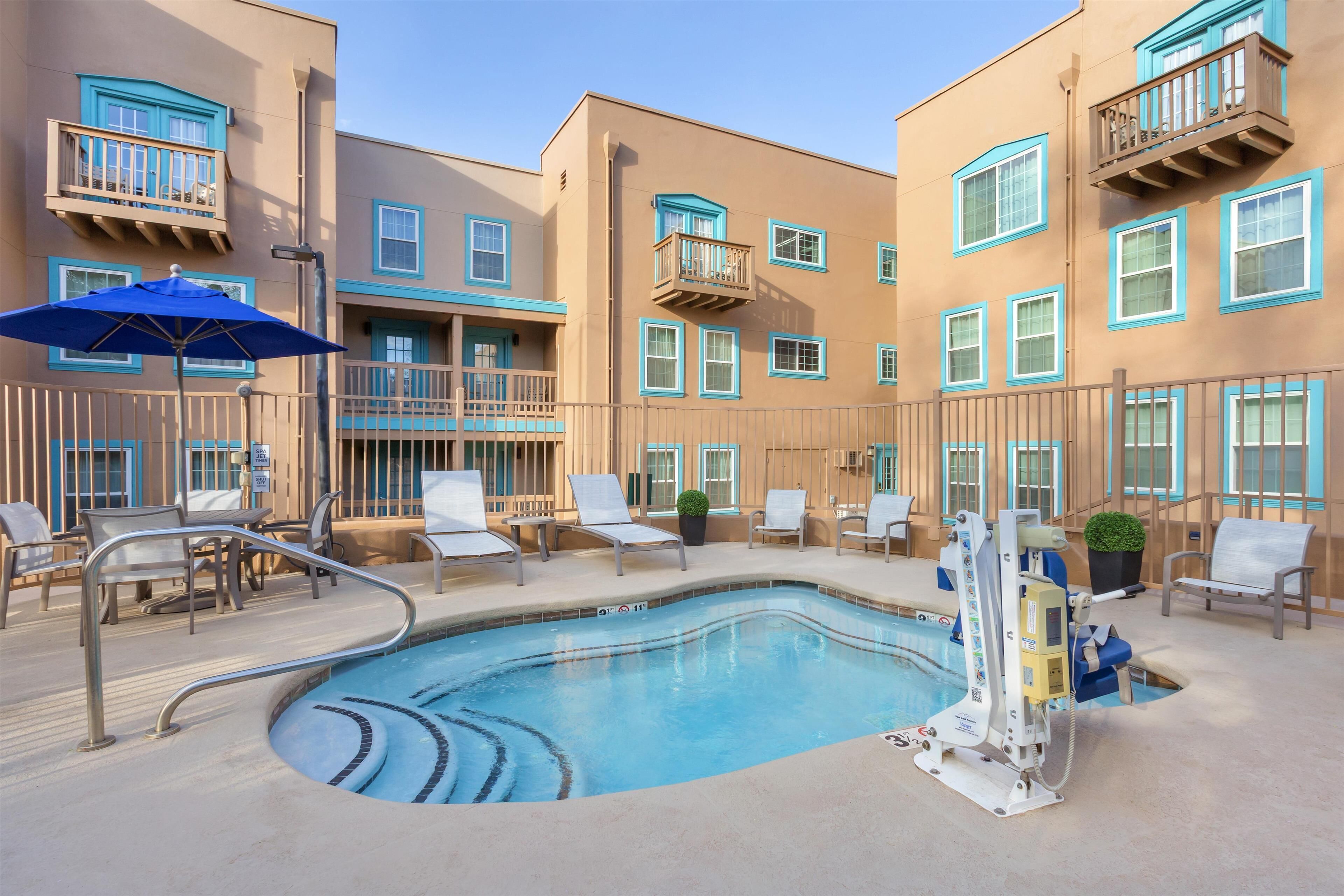 outdoor pool, pool umbrellas, pool loungers