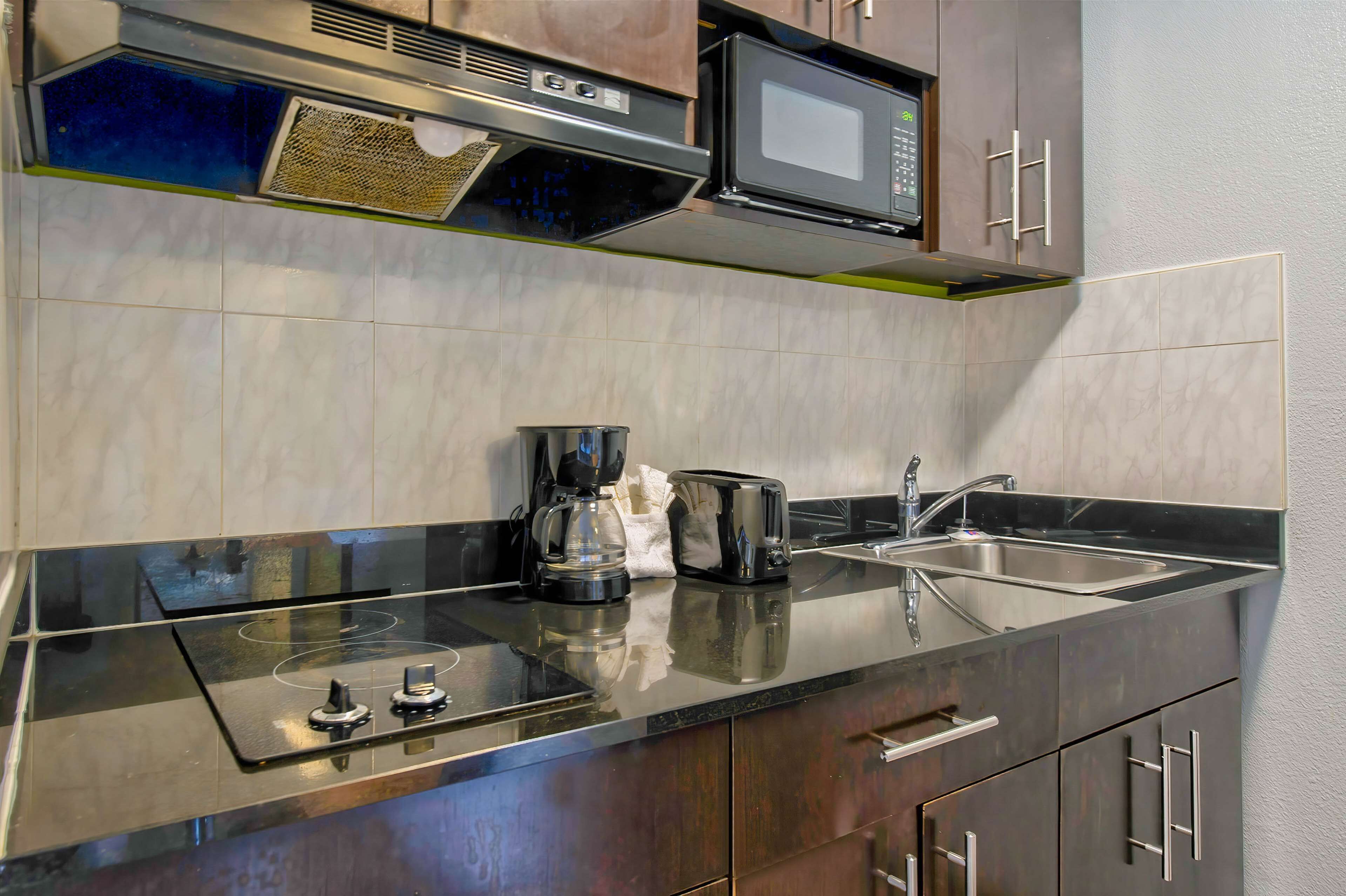 Fridge, microwave, stovetop, cookware/dishes/utensils