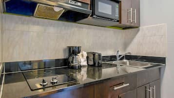 Fridge, microwave, stovetop, cookware/dishes/utensils