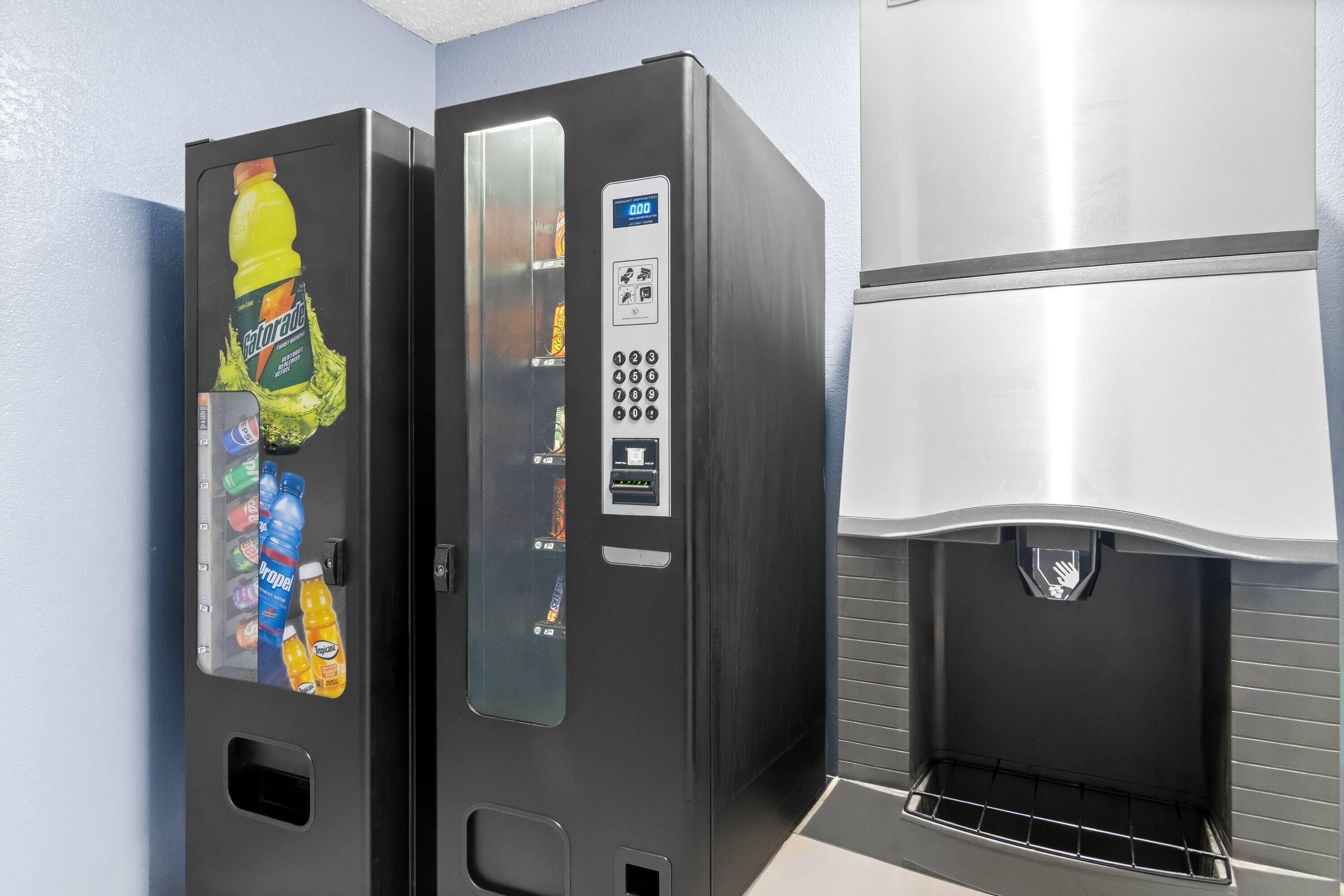 A vending machine with a Gatorade bottle and a water dispenser.