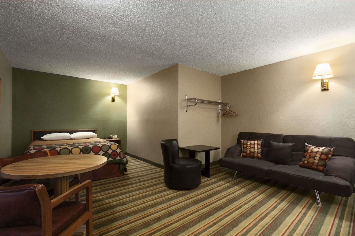 Premium bedding, desk, laptop workspace, blackout curtains