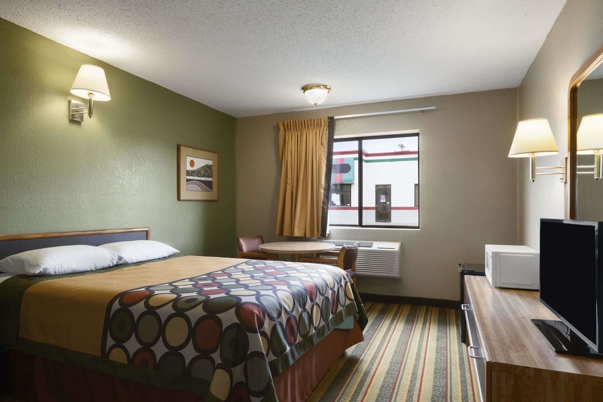 Premium bedding, desk, laptop workspace, blackout curtains