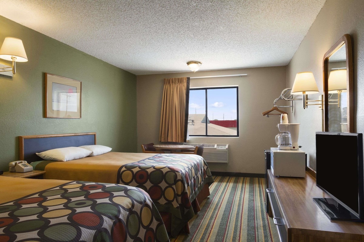 Premium bedding, desk, laptop workspace, blackout curtains