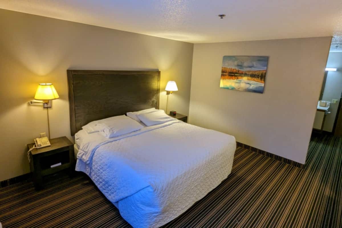 Premium bedding, desk, laptop workspace, blackout curtains