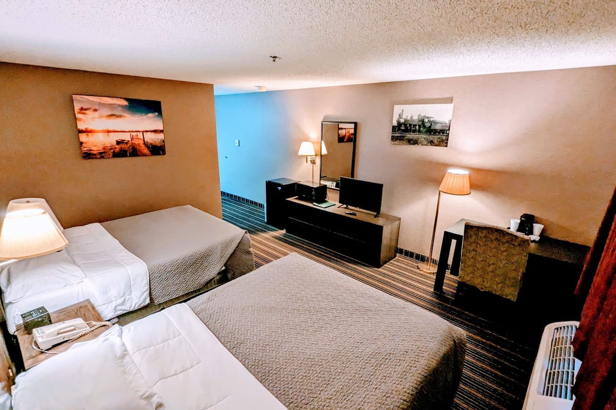 premium bedding, desk, laptop workspace, blackout curtains