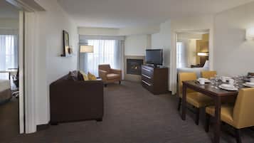 Suite, 2 Bedrooms, Non Smoking | Living area | 50-inch flat-screen TV with cable channels, TV