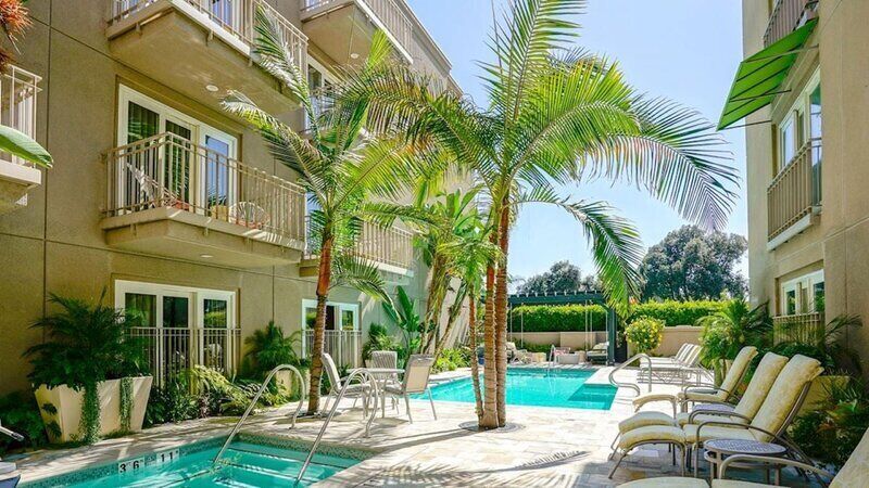 Outdoor pool, open 7:00 AM to 10:00 PM, pool umbrellas, pool loungers