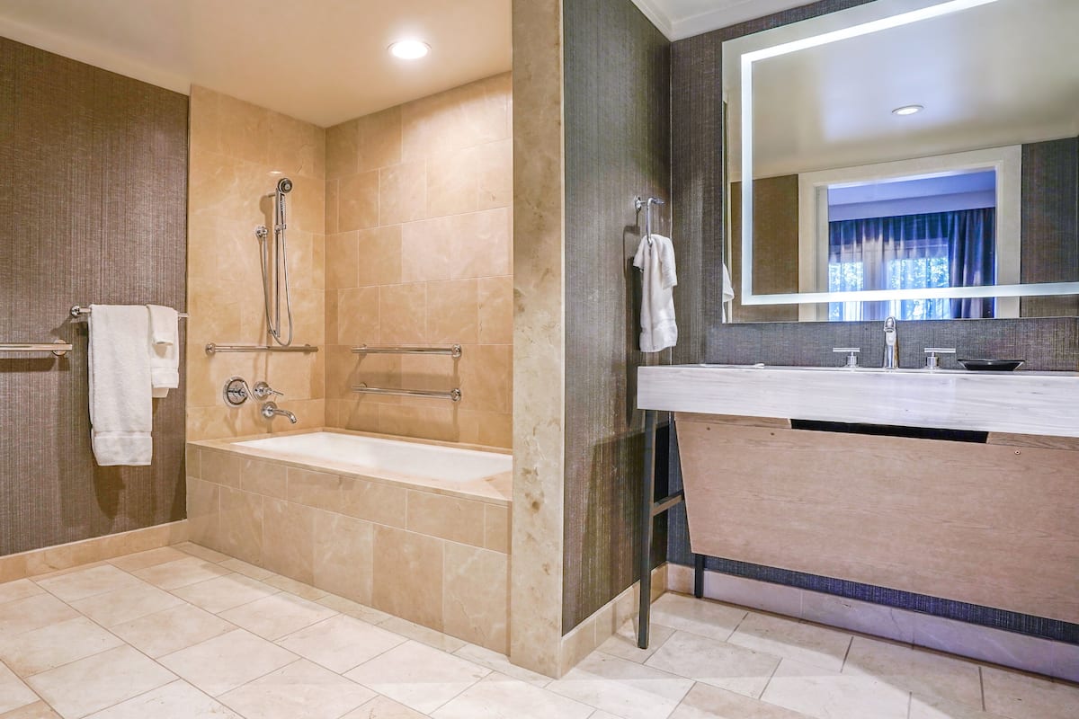 designer toiletries, hair dryer, bathrobes, towels