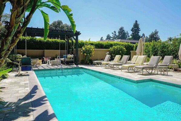 Outdoor pool, open 7:00 AM to 10:00 PM, pool umbrellas, pool loungers