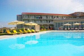 Indoor pool, outdoor pool, pool umbrellas, sun loungers