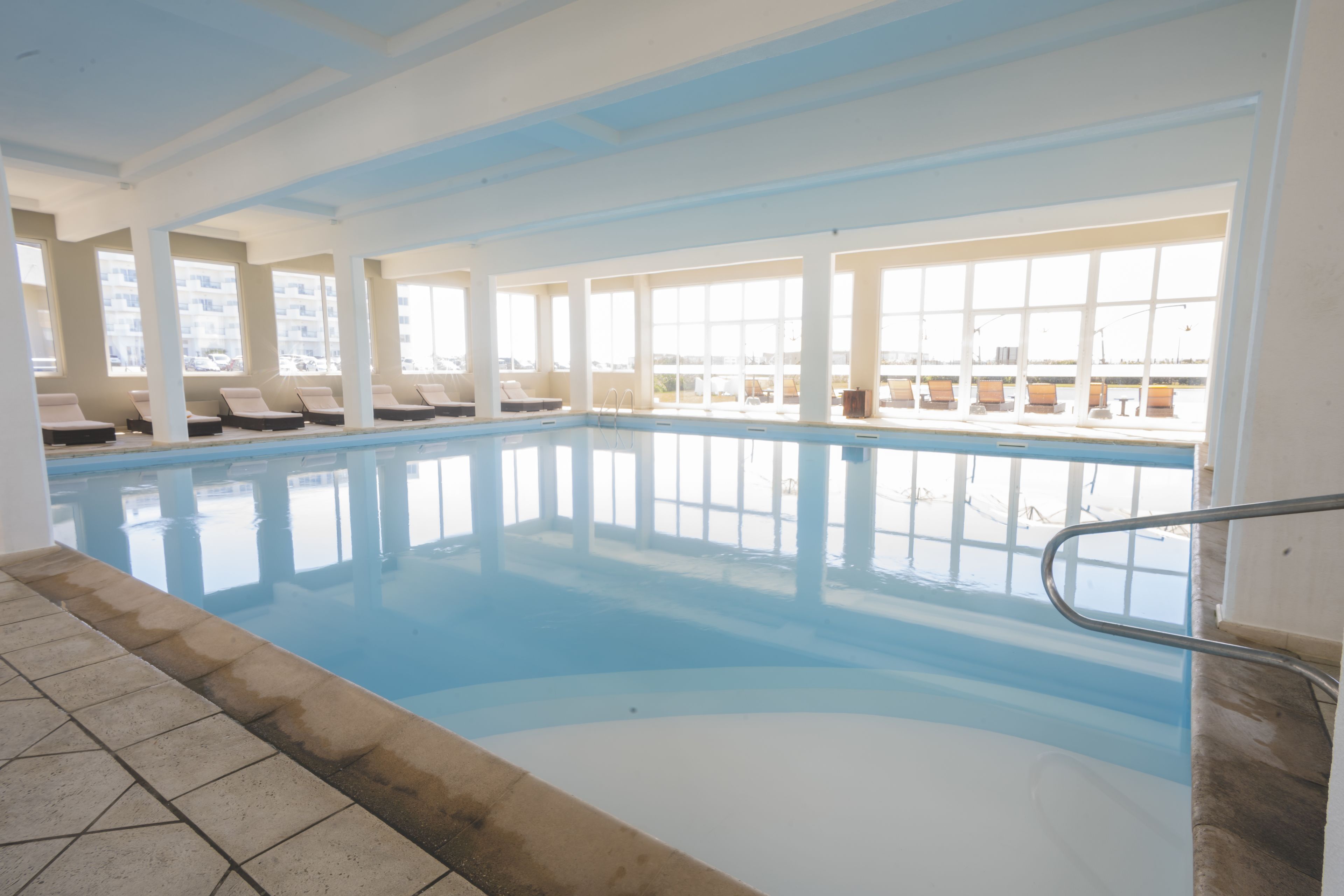 indoor pool, seasonal outdoor pool, pool umbrellas, pool loungers