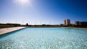 A clear blue sky with the sun shining brightly over a swimming pool. - Star Inn Peniche (Peniche)