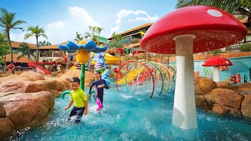 Children can play and splash in the water feature surrounded by slides and climbing elements.