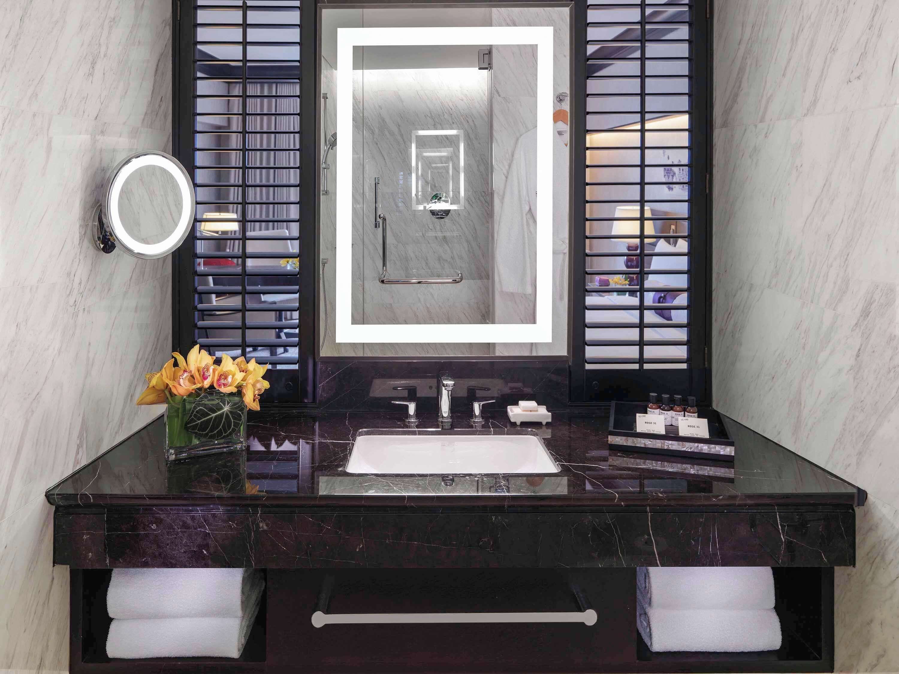 designer toiletries, hair dryer, bathrobes, slippers