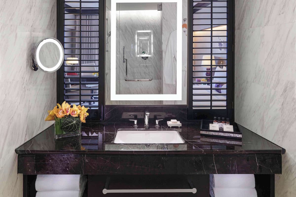 designer toiletries, hair dryer, bathrobes, slippers