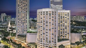 A high-rise building with multiple floors, large windows, and a modern architectural design.