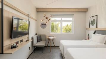 Habitación Deluxe con 2 camas individuales | Minibar, caja de seguridad en la habitación y cortinas blackout