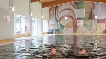 Indoor pool, open 7:30 AM to 7:00 PM, pool loungers, lifeguards on site