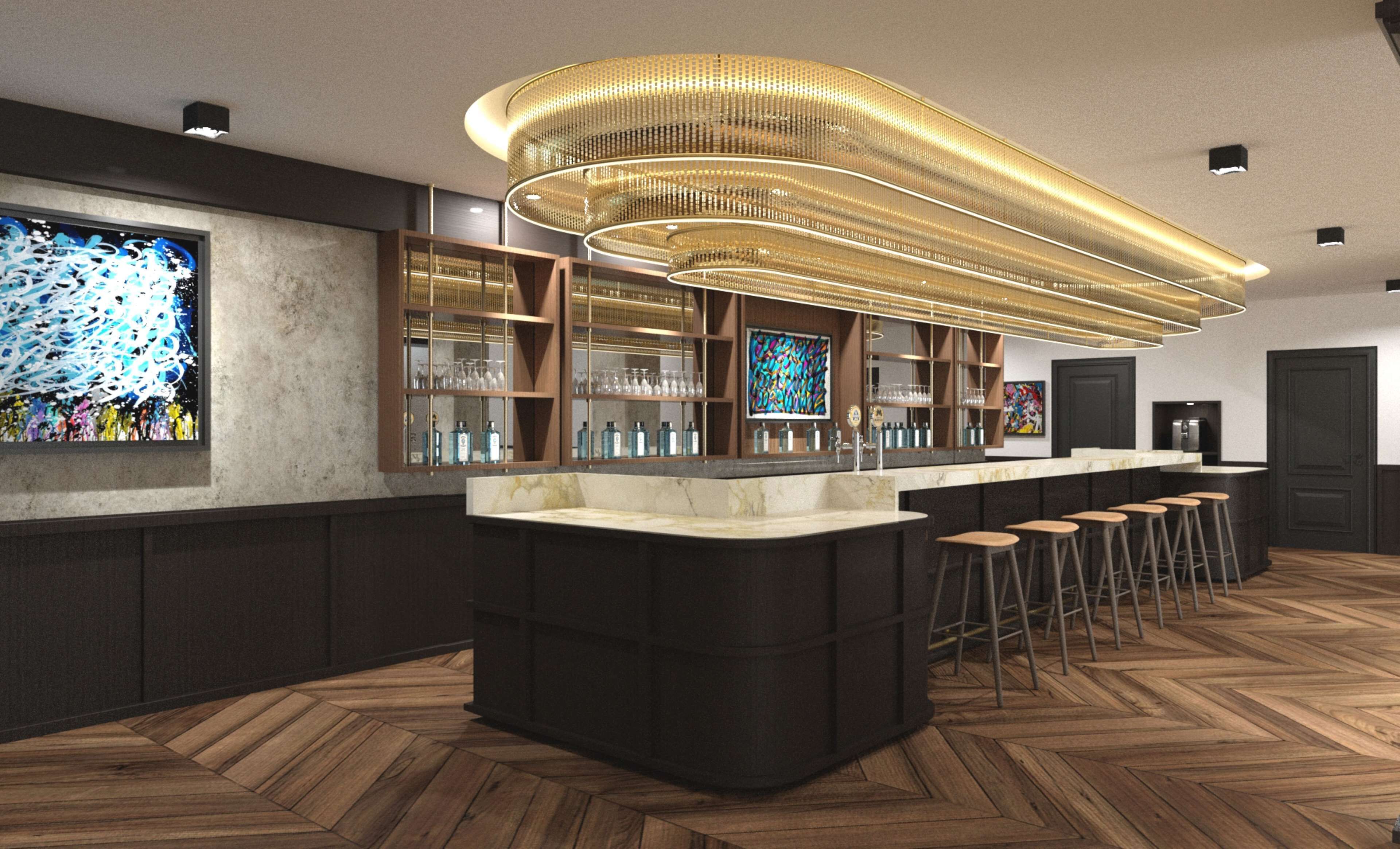 A modern bar area with a central island, bar stools, and a unique ceiling light fixture.