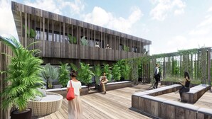 A modern building with a wooden facade, outdoor seating areas, and lush greenery. - Marty Hotel Bordeaux, Tapestry Collection by Hilton (Bordeaux)