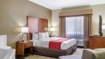 Suite, 1 King Bed, Jetted Tub | Down comforters, pillowtop beds, in-room safe, individually decorated