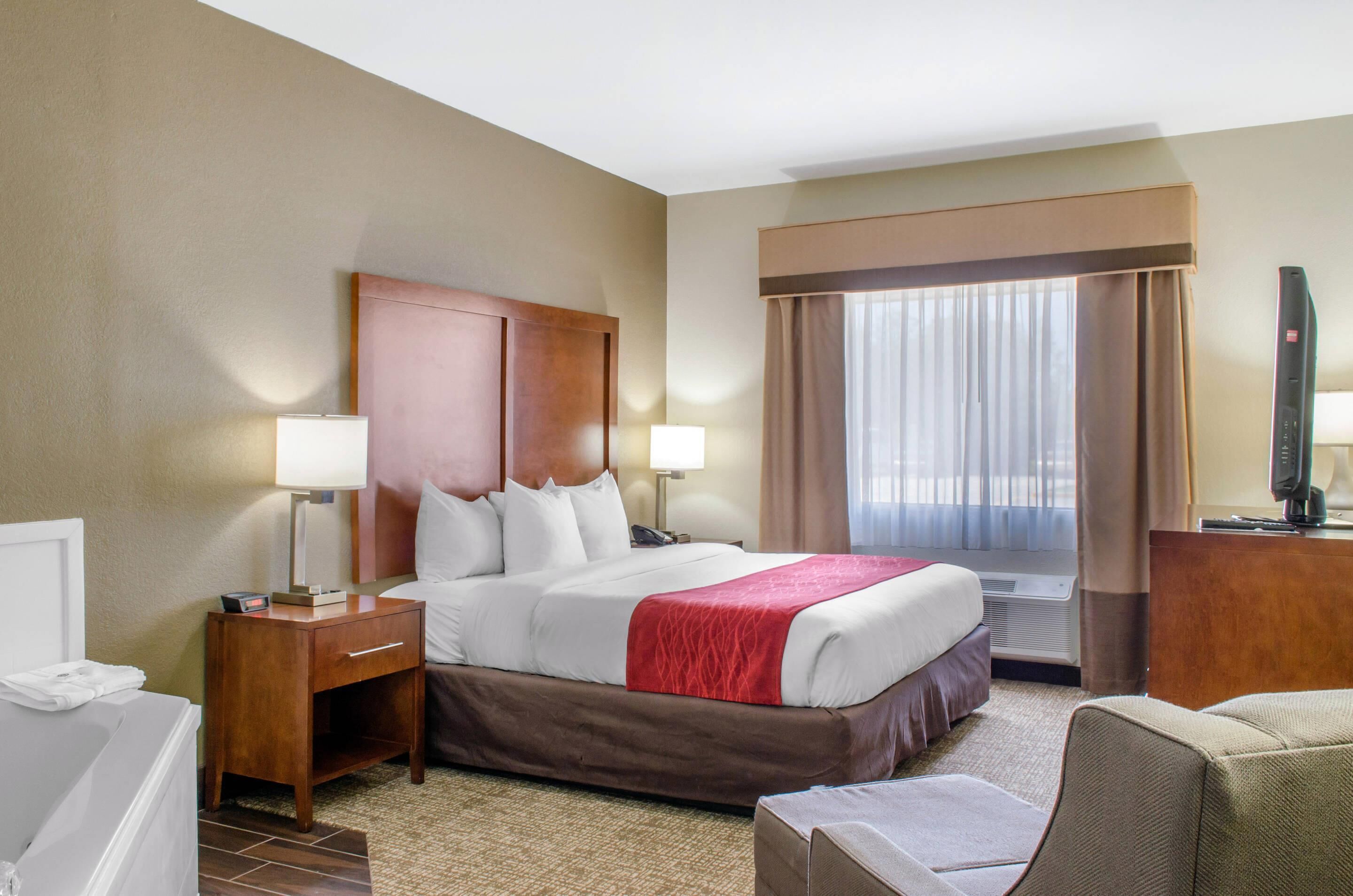 Suite, 1 King Bed, Jetted Tub | Down comforters, pillowtop beds, in-room safe, individually decorated