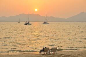 On the beach, sun loungers, beach umbrellas, beach towels
