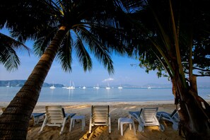 On the beach, sun-loungers, beach umbrellas, beach towels