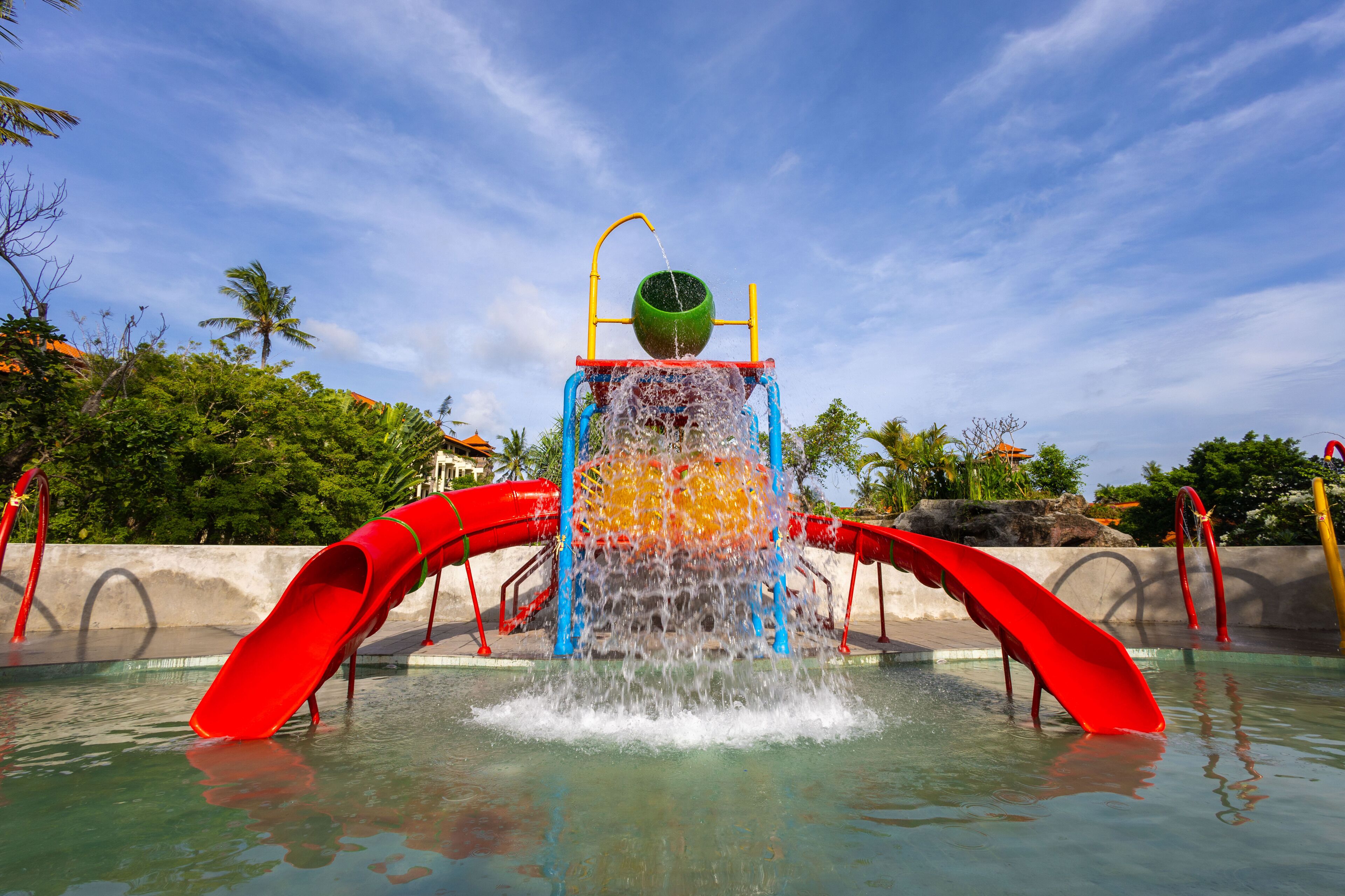 A water play area with a central water feature and slides.