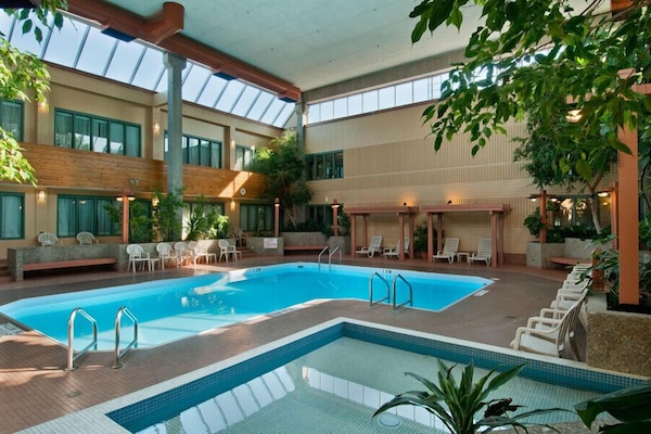 Indoor pool, open 9:30 AM to 10:00 PM, pool loungers