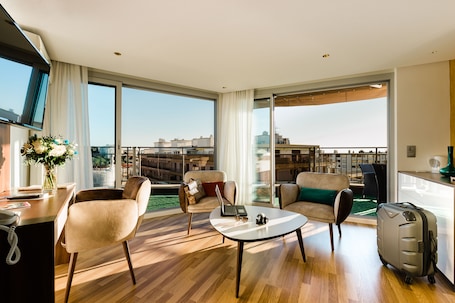 Suite, Sea View | Living area | 150-cm LED TV with satellite channels, TV. Hotel Helios
