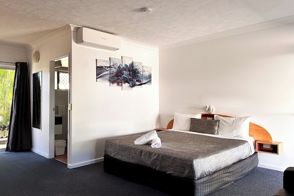 Desk, laptop workspace, blackout curtains, iron/ironing board