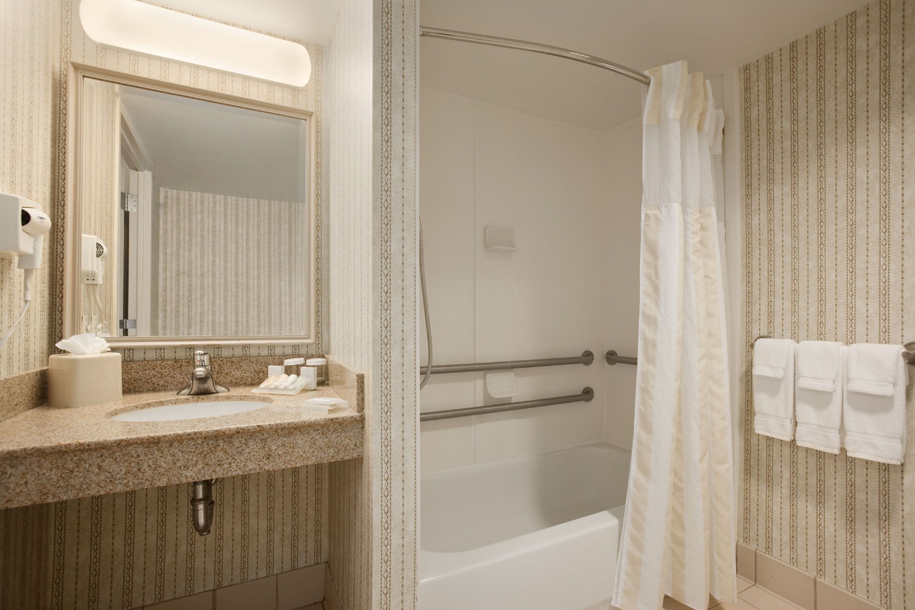 bathtub, hair dryer, towels