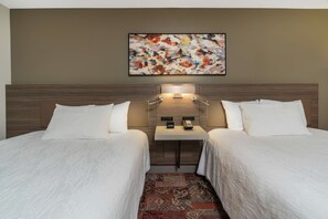 Luxe beddengoed, pillowtop-bedden, een kluis op de kamer