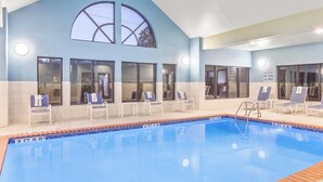 A swimming pool with lounge chairs and a sign indicating shallow water no diving allowed. - Holiday Inn Express & Suites Greenville-Spartanburg (Duncan) by IHG (Duncan)