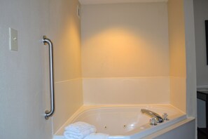 Suite, 1 King Bed, Non Smoking, Jetted Tub | Bathroom | Combined shower/bathtub, free toiletries, hair dryer, towels