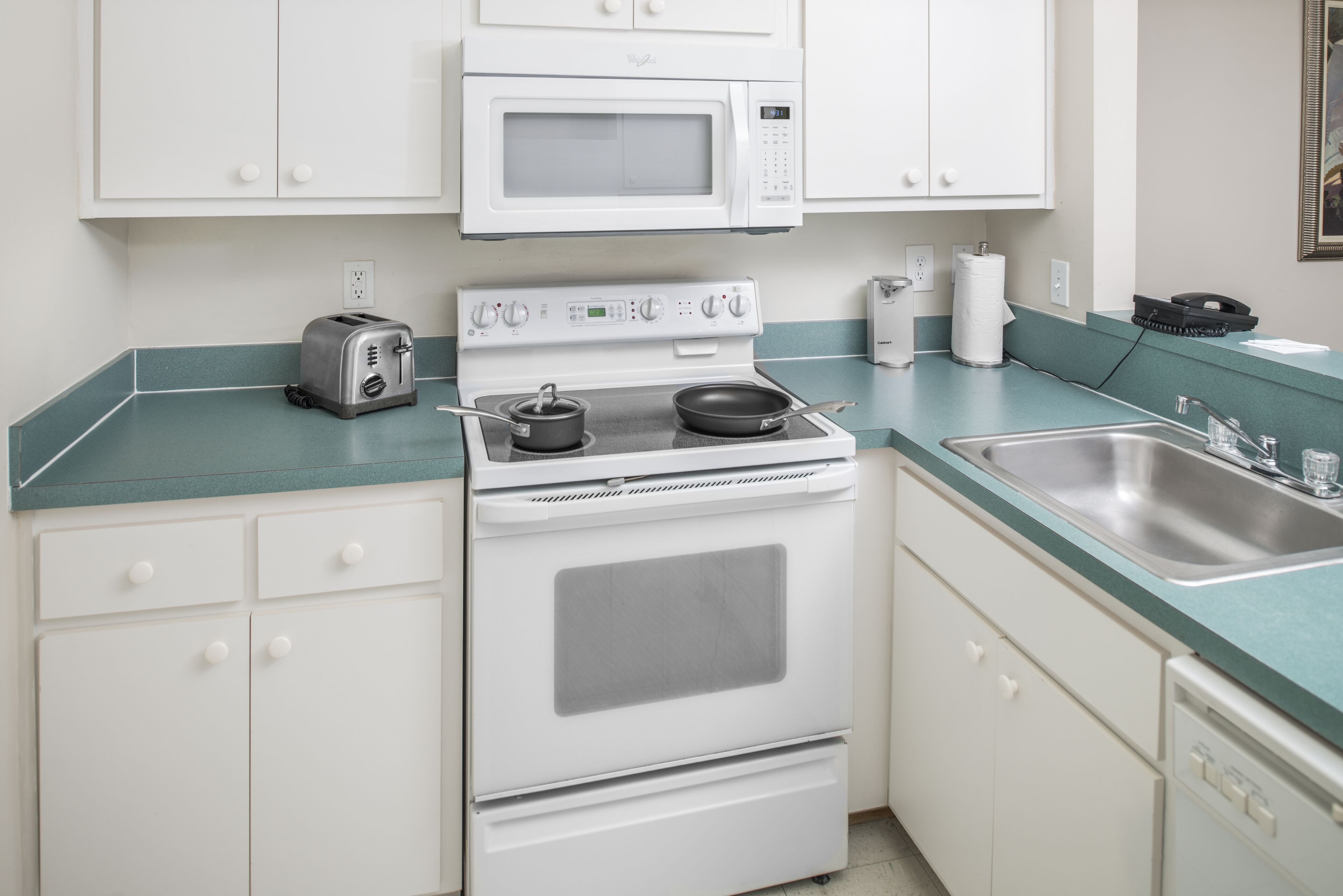 full-sized fridge, microwave, oven, stovetop