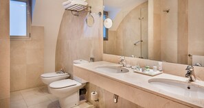 Bathtub, eco-friendly toiletries, hair dryer, towels